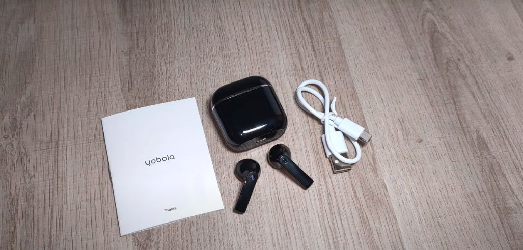 Yobola Earbuds along with it's manual and charger 