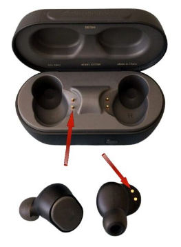 Earbuds placed out of the case exposing the charging contacts