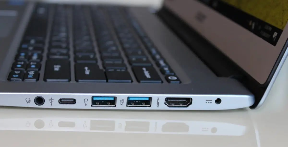 A laptop from one side showing its various ports
