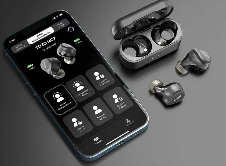 TOZO app interface on cell phone with the earbuds along side