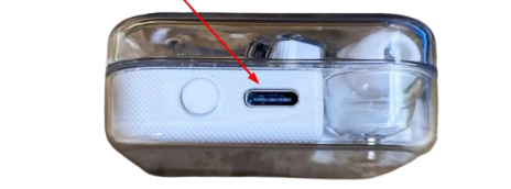 A red arrow pointing towards charging port of the nothing ear 1