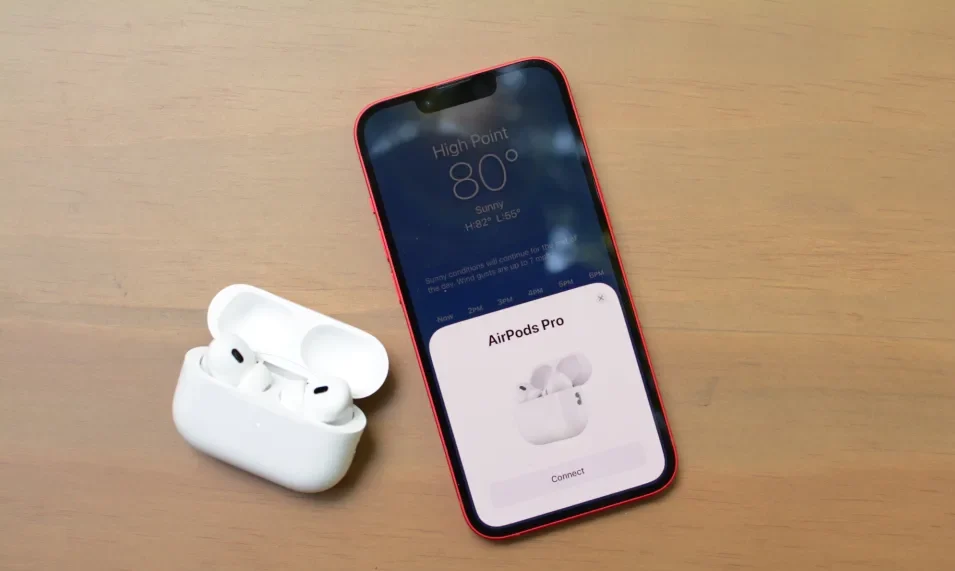 AirPods Placed Along with iPhone on wooden surface